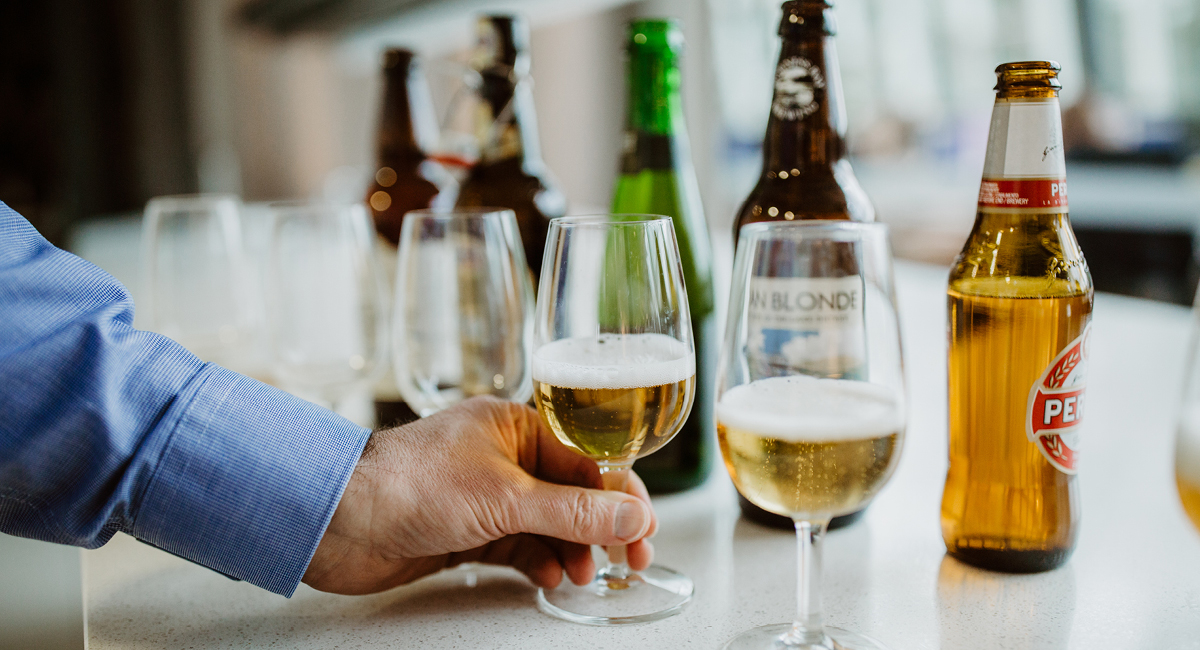 Example of Pete tasting beers, with beer sitting in glasses