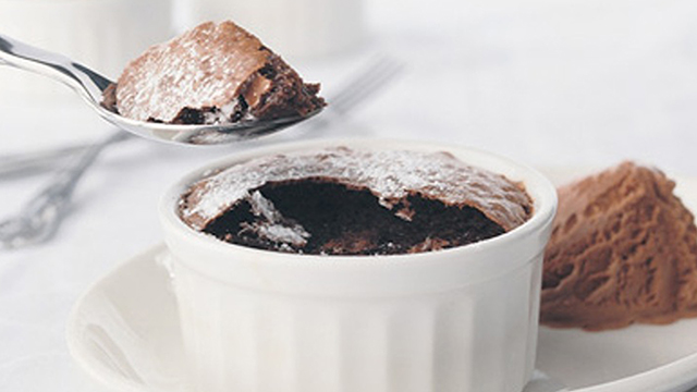 Chocolate Souffles, served in a ramekin with a side of chocolate ice cream