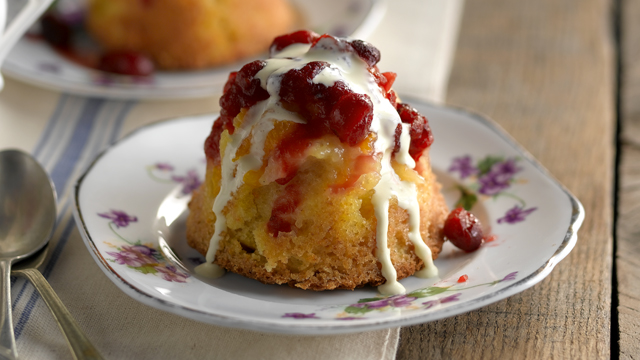 Clementine Cakes served on floral plates with cranberry sauce and cream