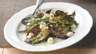 Italian Grilled Vegetables with Feta Cheese and dressing served in a white dish