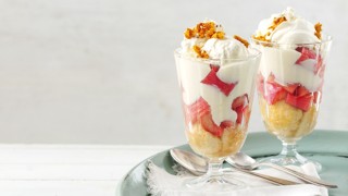 Rhubarb Trifle served in a glass dish topped with ice cream