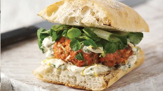 Fresh Salmon Burgers with lemon, caper and dill mayonnaise, served on a toasted ciabatta bun