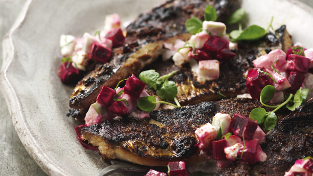 Tandoori Spice Mackerel with Beetroot and Yoghurt Dressing seved in a dish with fresh green vegetables