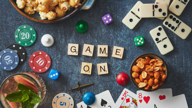A winning night in blog header showing a games night table with 'Game on' spelt out in scrabble letters
