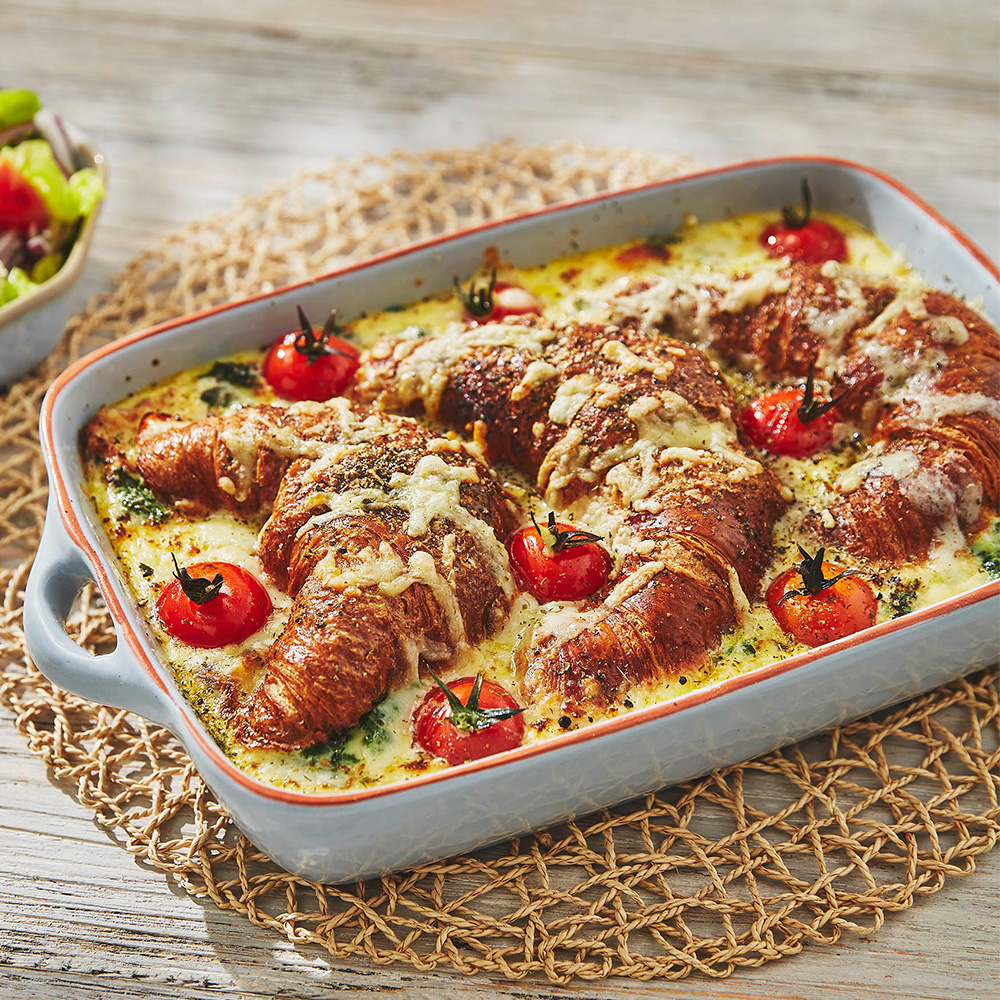 Image of savoury bread and butter pudding made with croissants, cheddar cheese and cherry tomatoes