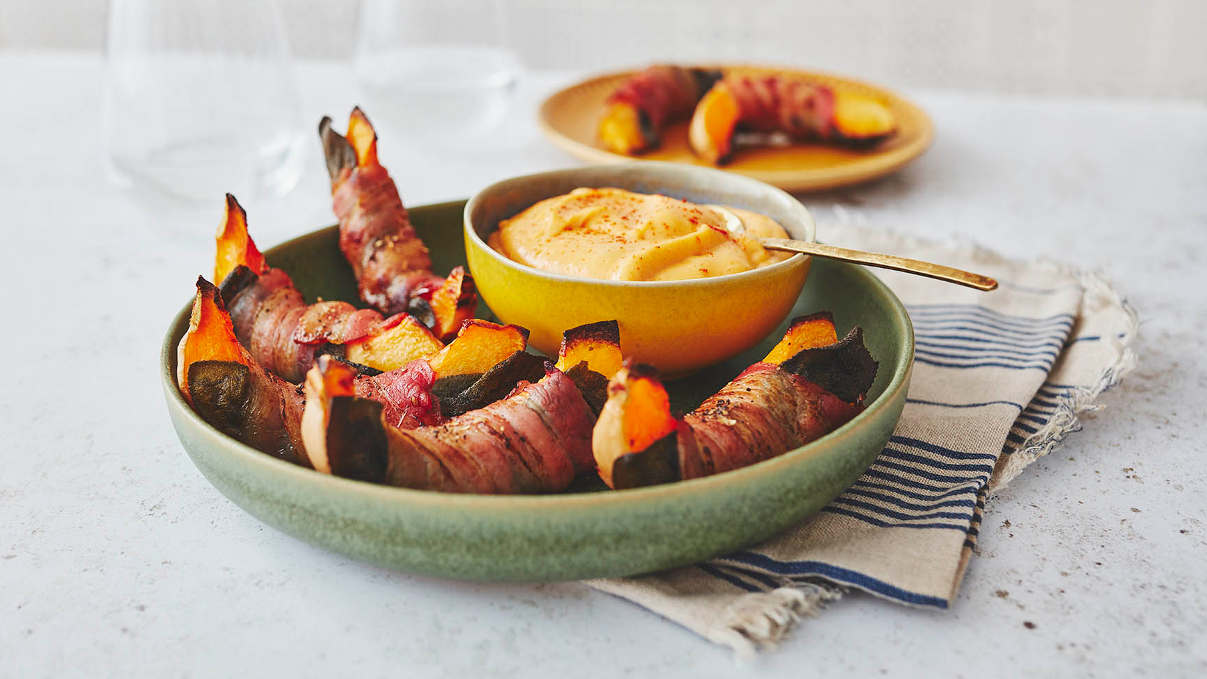 Bacon wrapped pumpkin with a cheese dip
