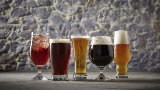 Various types of beers lined up in a row