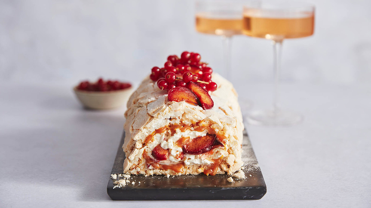 Coconut Meringue Roulade with Roasted Plum Filling and Coconut Praline