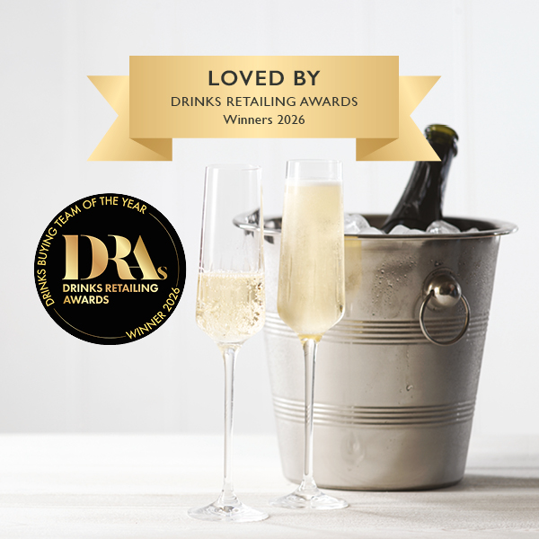 Image of a chilled champagne bottle and two glasses of champagne 