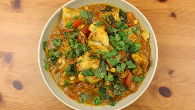 Rafi's Spicebox Do Piyaza Curry Pack with Coley served in a white bowl topped with coriander