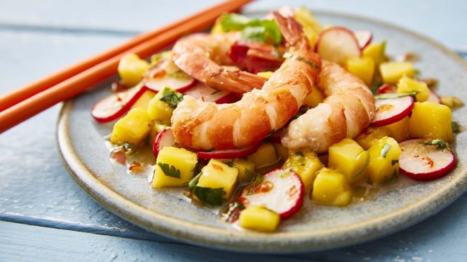 Jasmine Tea Prawns served on a plate with chopsticks