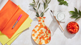 Children's craft that looks like a Greek inspired mosaic vase made from card and tissue paper
