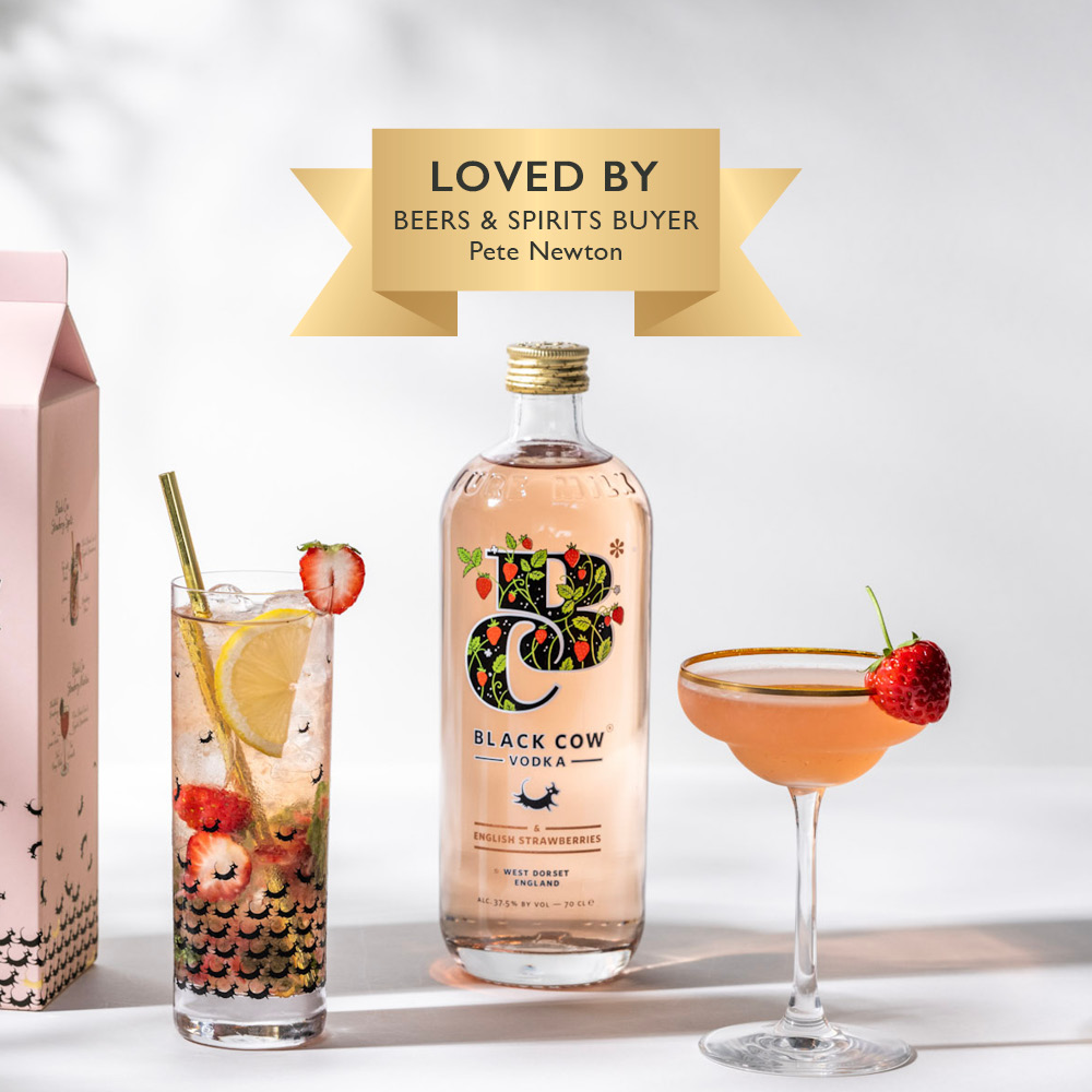 Image of Black Cow Strawberry Vodka next to a cocktail