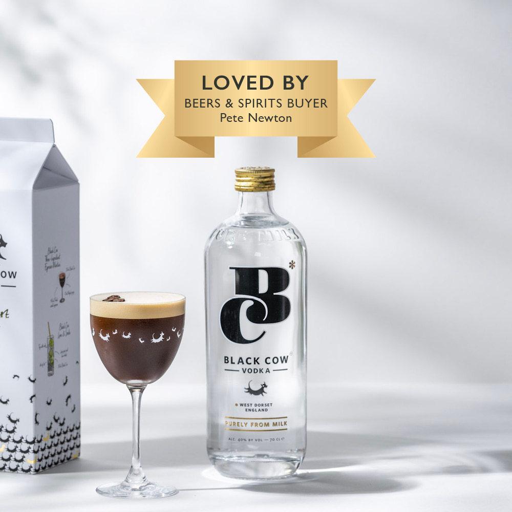 A bottle of Black Cow Original Vodka next to an Espresso Martini