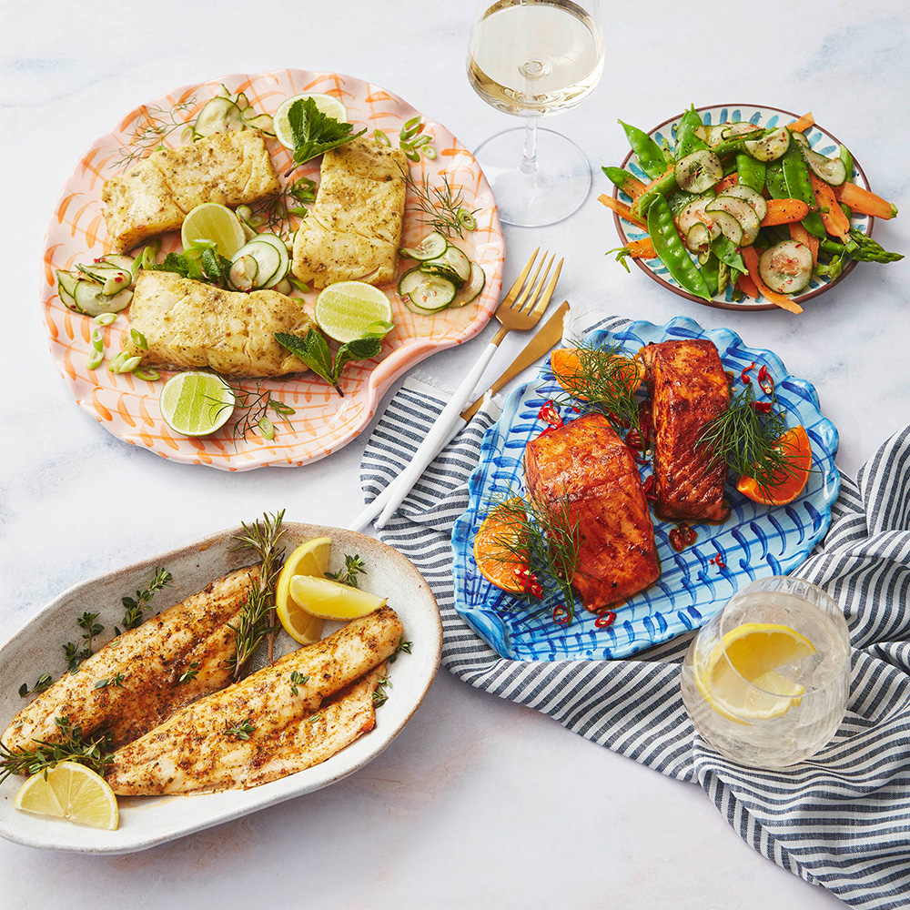 An image of 3 plates of marinated fish