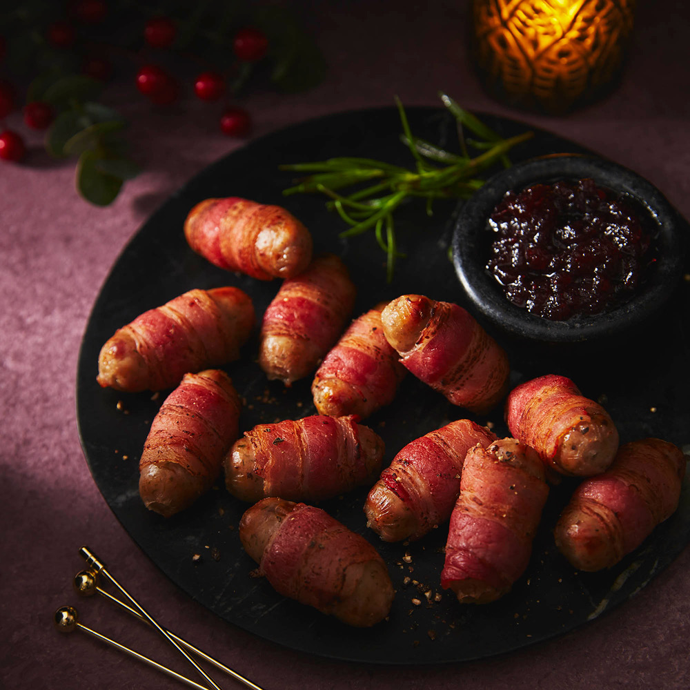 Image of a plate of new caramelised onion pigs in blankets