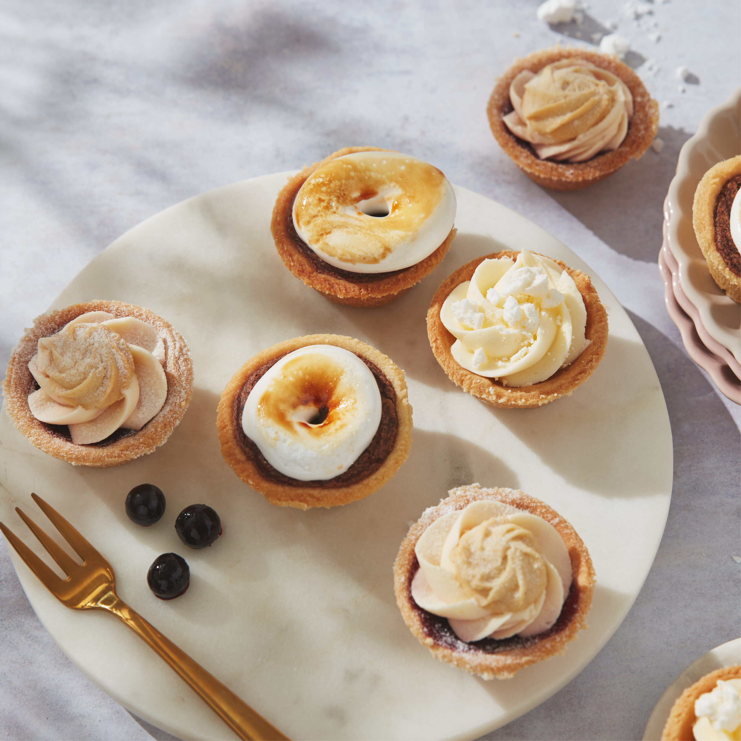 Image of a selection of tarts laid out on a plate