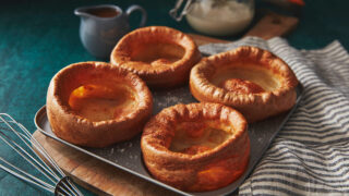 4 sourdough Yorkshire puddings in a baking tray