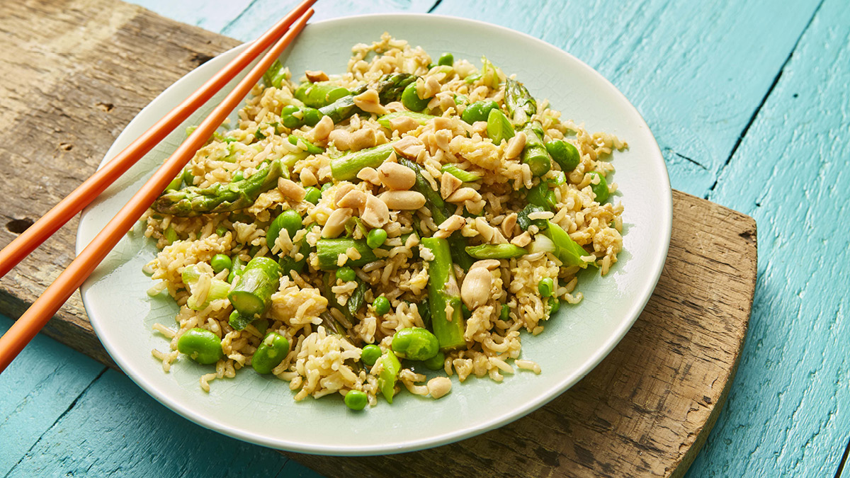 Spring Fried Rice served on a plate with chopsticks