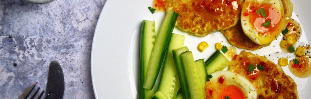 Sweetcorn Fritters with jammie eggs served with cucumber sticks