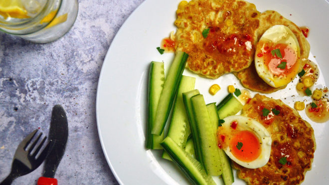 Sweetcorn Fritters with jammie eggs served with cucumber sticks