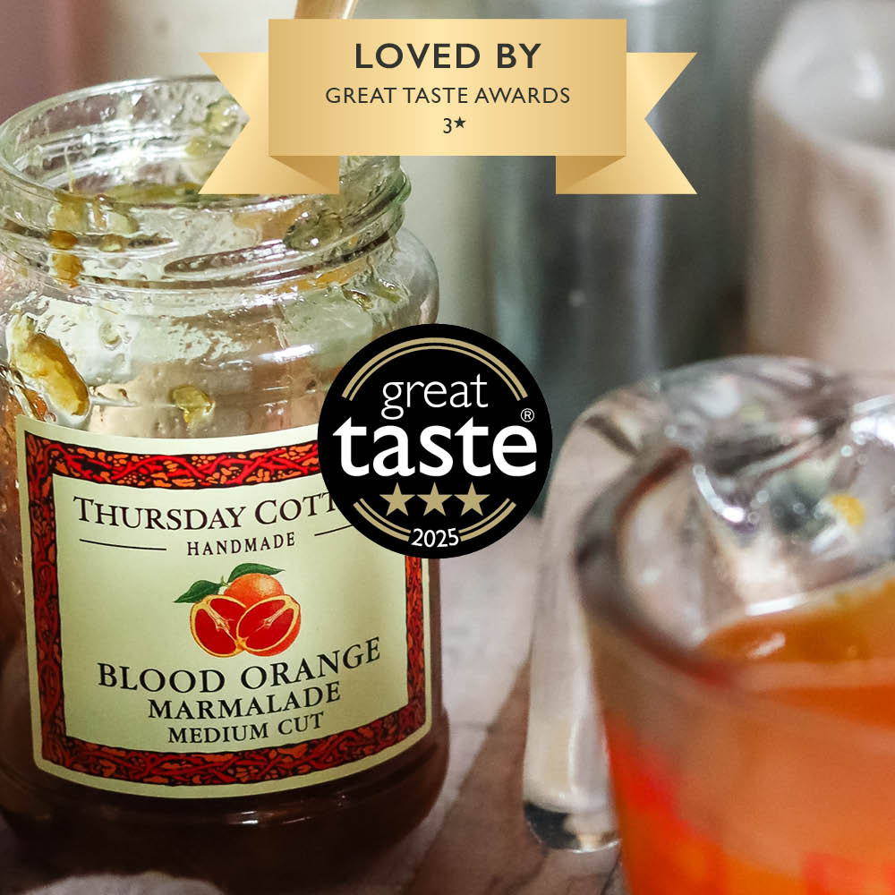 Image of a jar of Thursday Cottage Blood Orange Marmalade being used to make jelly