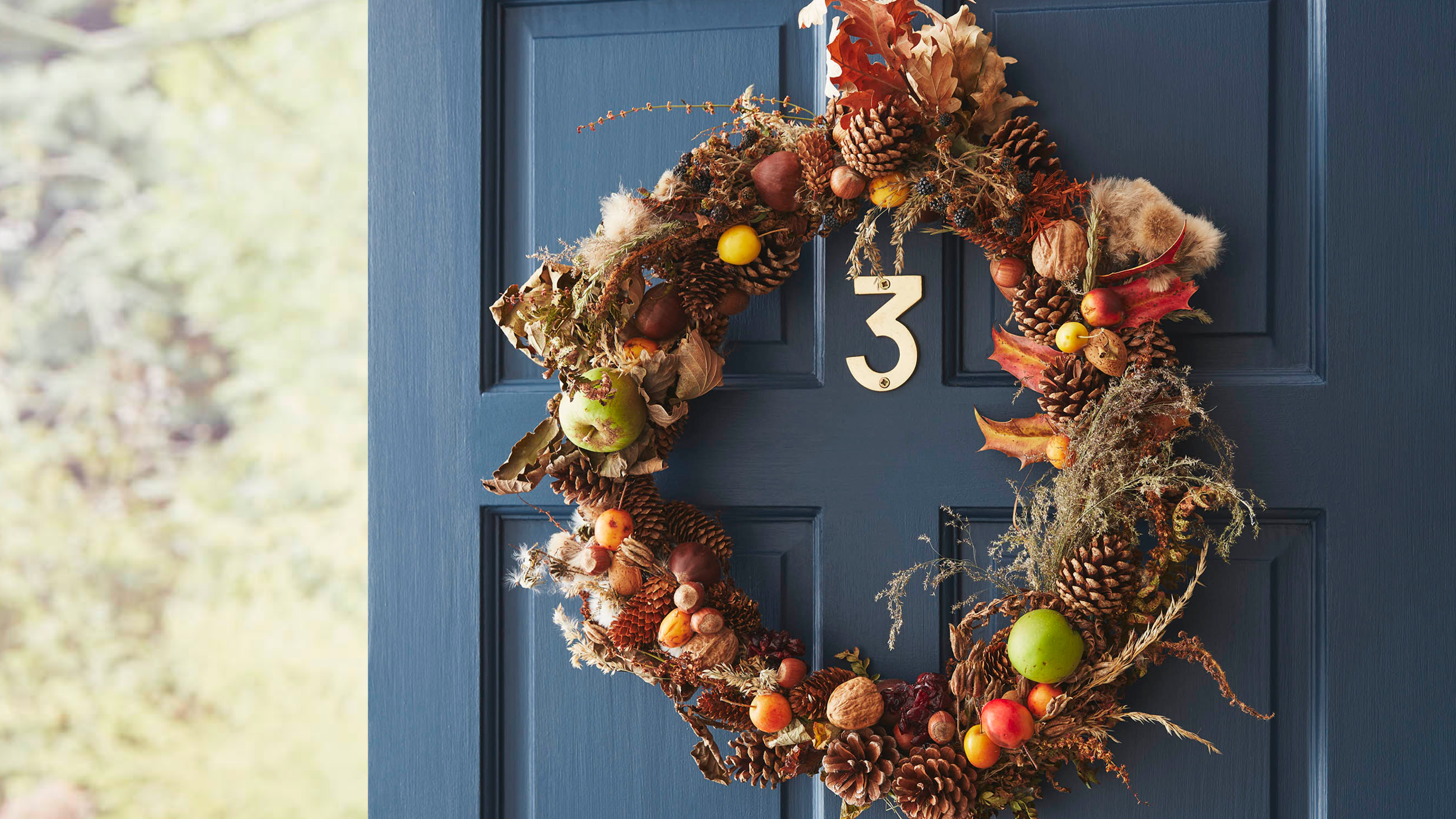 Image of a handmade autumn wreath hung up on a front door
