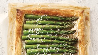 Asparagus Tart with Black Olive Dressing served on baking parchment