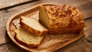 Saltaire Blonde, Jalapeno and Cheddar Beer Bread served on a wooden board and sliced