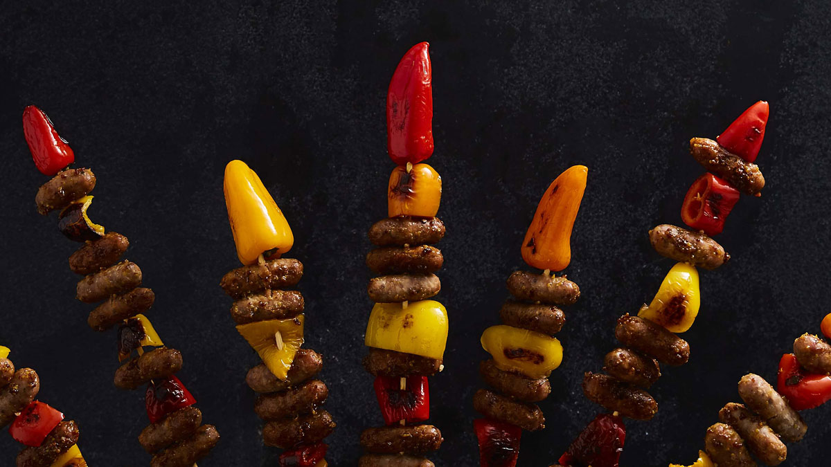 Bonfire Banger' Sausage Rockets served on skewers with peppers
