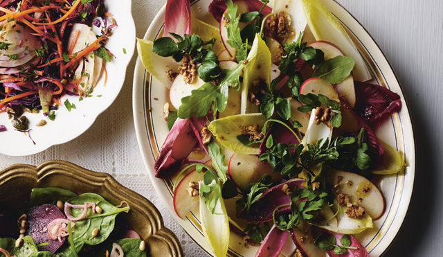 Chicory, Apple and Walnut Salad served on a white dish topped with walnuts