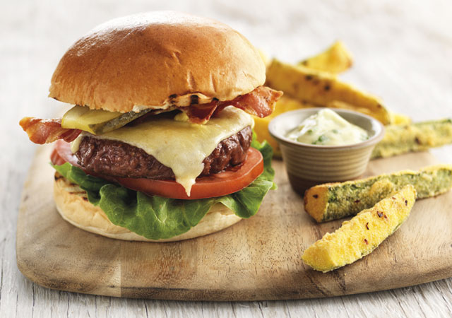 Gourmet Beef Burger served on a bun, with Courgette Chips on a board