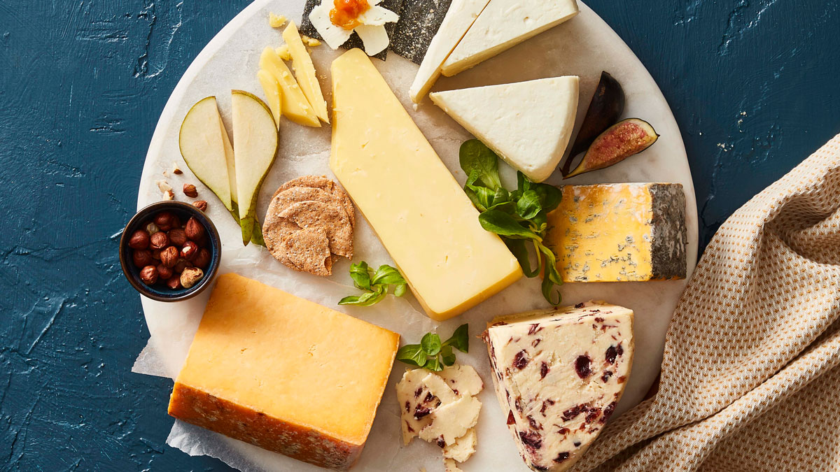 A cheese board on a blue surface