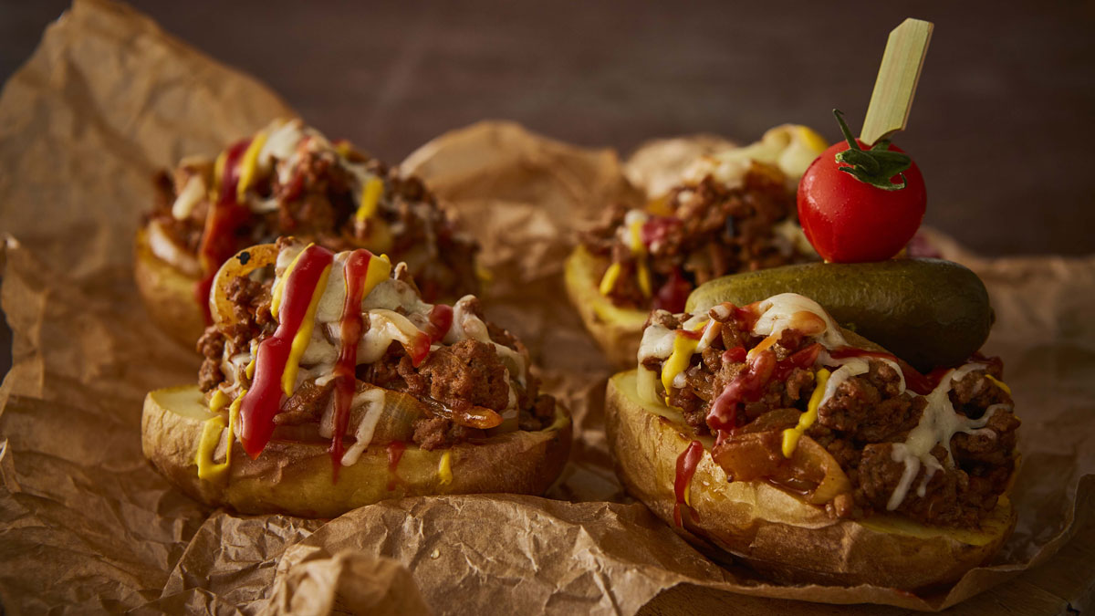 Cheeseburger Potato Skins served on parchment paper