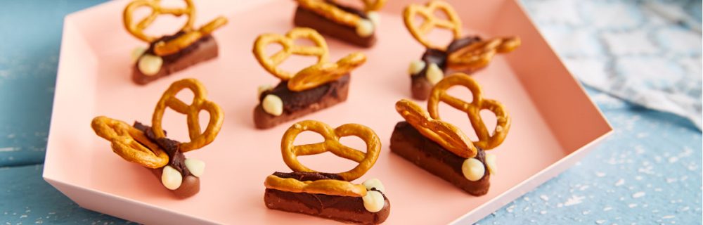 Easy Chocolate Butterflies served on a pink hexagonal plate