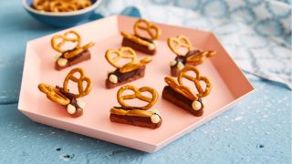 Easy Chocolate Butterflies served on a pink hexagonal plate