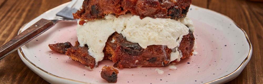 Caramelised Christmas Pudding Ice Cream Sandwiches served on a pink plate