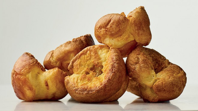 Perfect Yorkshire Puds stacked on top of one another