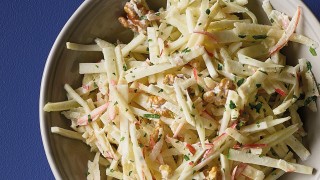 Celeriac, Fennel and Apple Salad with parsley and walnuts served in a grey bowl