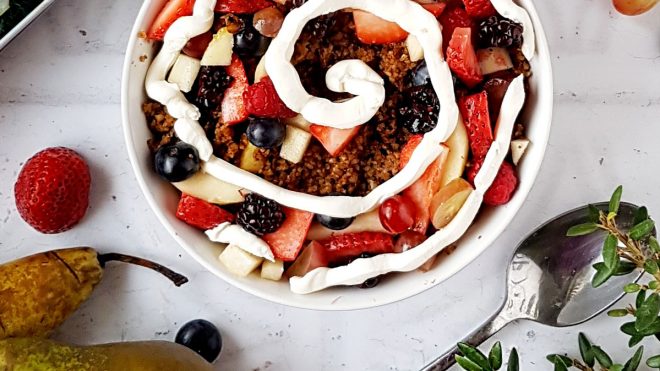 Apple and Cinnamon Baked Oatmeal served in a bowl and topped with berries and plain yoghurt
