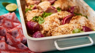 Coconut and Cardamom Chicken Tray Bake served in a baking dish topped with coriander