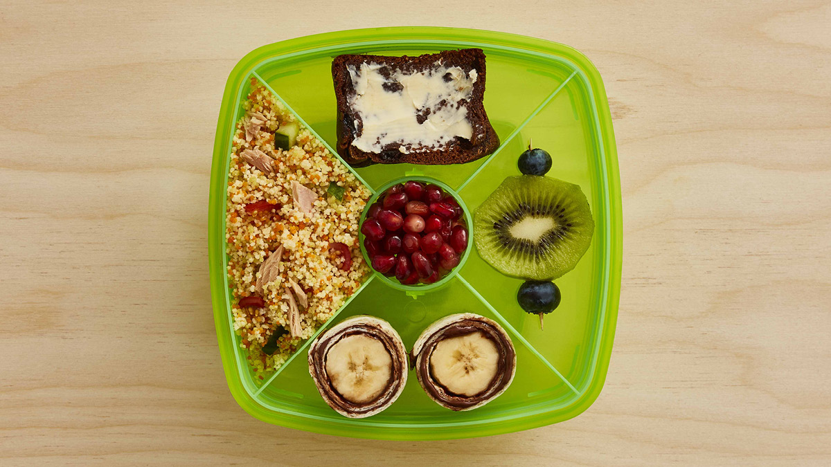 Couscous Salad Lunchbox with various fruit snacks