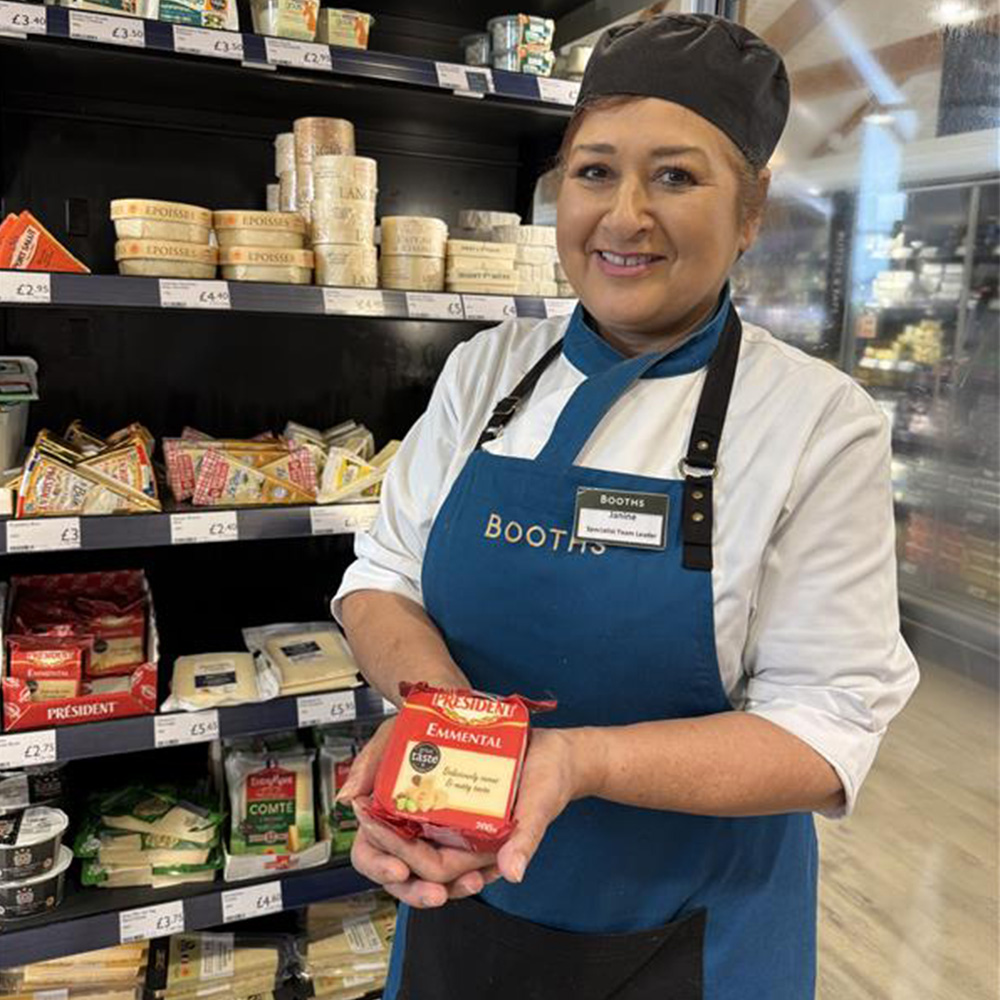 Image of Booths colleague holding Président Emmental cheese