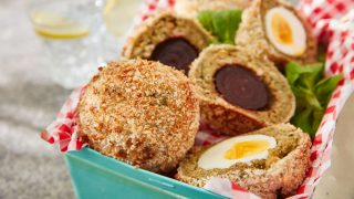 Falafel Scotch Eggs served sliced to show the fillings