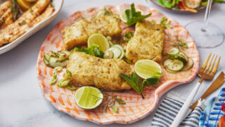 marinated cod on a pink plate