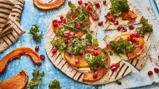 Flatbread 'Pizza' with Houmous, Squash and Kale with pomegranate seeds