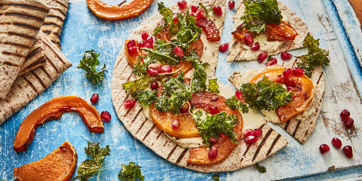 Flatbread 'Pizza' with Houmous, Squash and Kale with pomegranate seeds