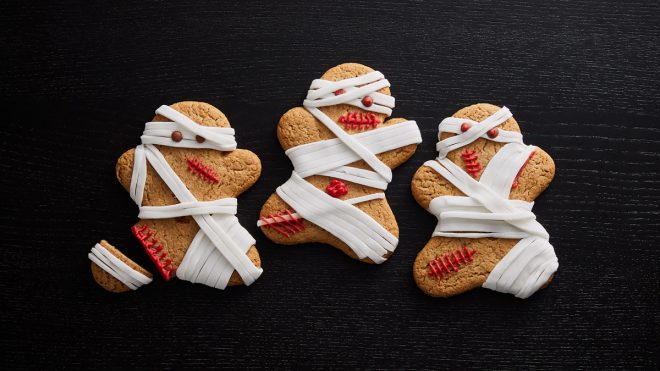 Gingerbread Zombie Mummies served on a black background