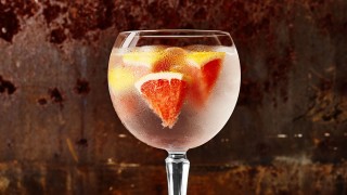 Ginspiration - Batch's Burnley Negroni served in a glass with ice and sliced blood orange