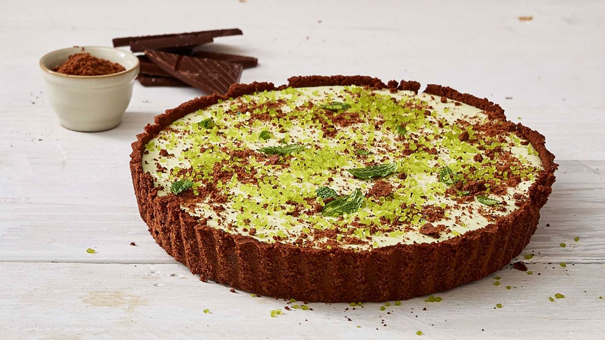 Festive Grasshopper Pie served on a white wooden table